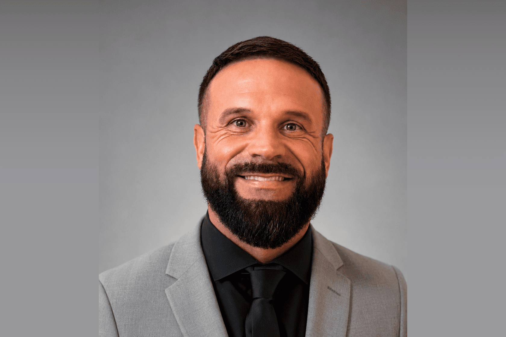 A two-time state-championship football coach who has turned struggling programs into champions his whole career. A man of deep faith and relentless positivity, Sam is someone Coach Holly sought out himself, because there is no one easier to talk to or more encouraging.